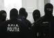 Percheziții de AMPLOARE la o firmă de curierat și la domiciliile unor angajați